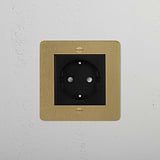 Elegant Schuko Socket in Antique Brass Black finish on a white textured wall, perfect for 1G Sockets & Modules.