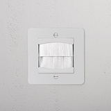 Paintable white single brush plate from 1G Sockets & Modules, designed for a clean cable entry.