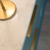 Antique Brass Oxford Furniture Handle 384mm, birds eye view of two fitted a cabinet drawers with a light reflecting onto the handle.