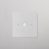 Paintable white 1G socket module on a textured white wall, designed to blend seamlessly into surroundings.