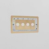 4G Switch Plate in Antique Brass on a white wall, part of the Brass Switch Plates collection for classic decor.