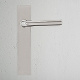 Apsley Long Plate Sprung Door Handle, polished nickel finish, displayed on a textured white wall.