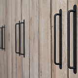 Bronze Kilburn Furniture Handles On Wooden Cupboards