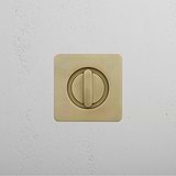 Regent Recessed Thumbturn brass lock on a textured white wall.