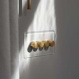 Clear Antique Brass 4G Two Way Dimmer Switch with four brass knobs on a transparent wall panel.