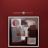 Abstract geometric painting in grays, whites, and browns on a red wall, lit by Taylor Picture Light 580mm.