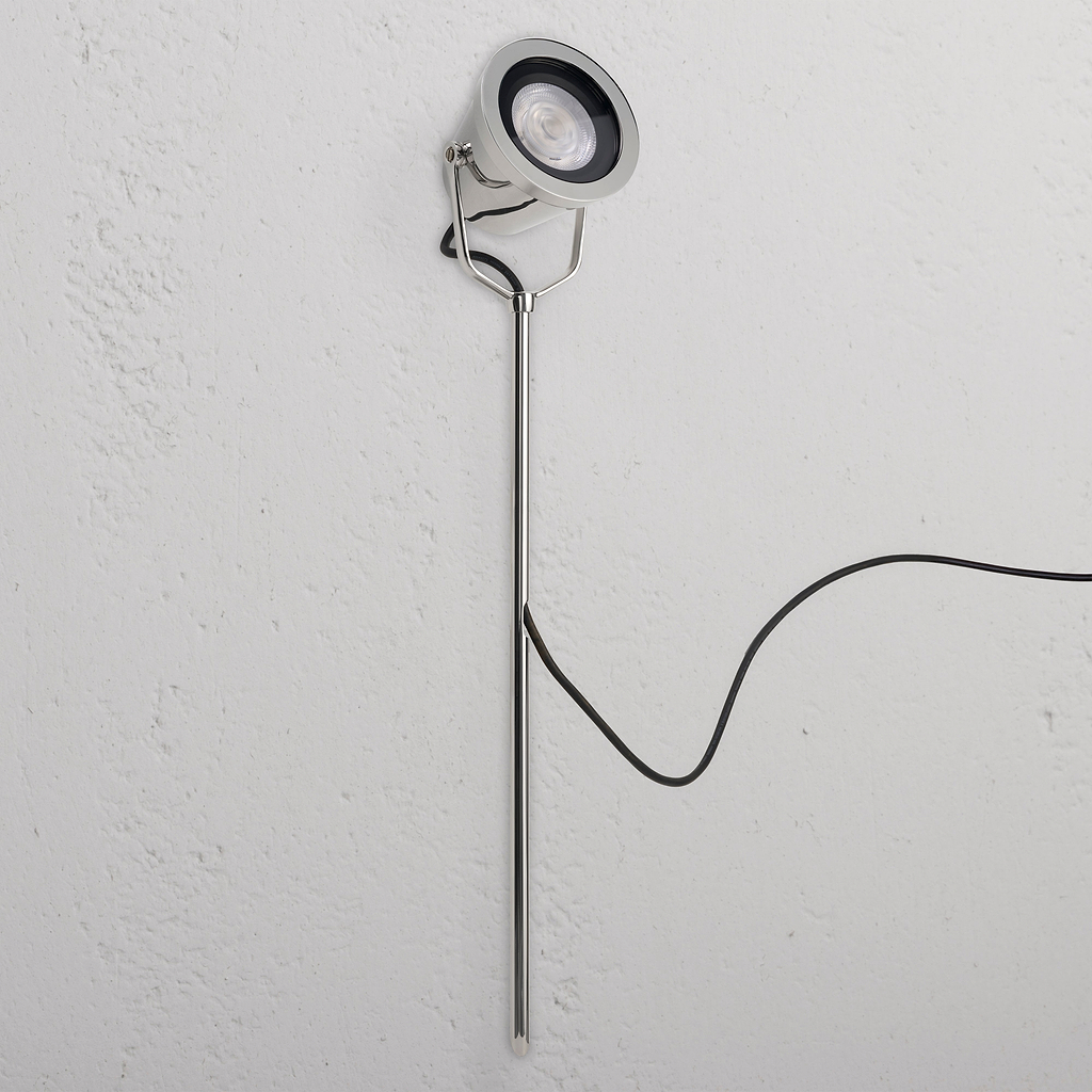Cambridge Ground Floodlight in polished nickel, outdoor design with sleek stand and visible black power cord.