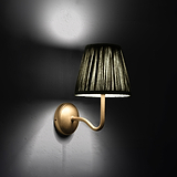 Medium Malvern Wall light in Deep Green at an angle and turned on at night