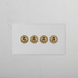 4G Two Way Toggle Switch in Paintable Antique Brass finish, mounted on a white wall.
