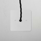 Flex Outlet - Paintable White: 1G socket with a square plate for seamless integration into white-painted walls.