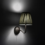 Medium Malvern Wall light in Deep Green at an angle and turned on at night