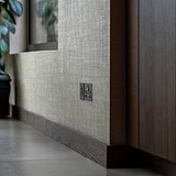 5A Light Socket in Bronze Black finish, suitable for 1G Sockets & Modules, installed on a textured wall.