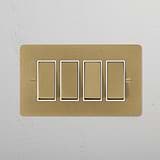 Antique brass 4G two-way rocker switch with white panel on wall, part of 4G switches & dimmers collection.