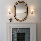 Malvern Small Wall Light Alabaster White with polished nickel finish mounted on a wall.