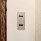 4G Vertical Two Way Toggle Switch in polished nickel on a white wall; part of 4G Switches & Dimmers collection.
