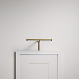 White door with antique brass towel bar, lit by Harrow Picture Light 220mm.