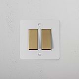 2G Two Way Rocker Switch in paintable antique brass on white, suitable for 2G switches and dimmers.