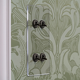 Clear bronze 4G vertical two-way toggle switch on green floral wallpaper, part of 4G Switches & Dimmers collection.