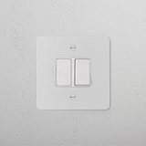 Switched Fused Spur (FCU) - Paintable White Isolator Switch on a textured white wall.