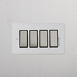 4G Two Way Rocker Switch in paintable polished nickel-black finish on a textured white wall, sleek and modern design.