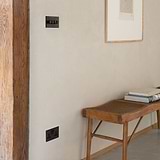 Double socket with 4g dimmer on wall near bench