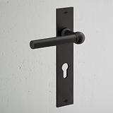 Harper Long Plate Door Handle & Euro Lock in bronze with sleek rectangular backplate on a white wall.