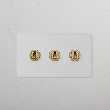 3G Two Way Toggle Switch - Antique Brass, paintable, on a white textured wall; part of 3G Switches & Dimmers.