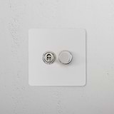 2G Mixed Switch 1T1D with a paintable polished nickel finish on a white textured wall.