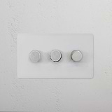 3G Dimmer Switch - Paintable Polished Nickel with three white knobs on a textured wall for elegant lighting control.