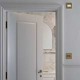 Antique brass white fan isolator switch with elegant design, suitable for bathrooms and other interior spaces.
