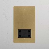 Antique Brass Black 2G shaver socket, installed on a white textured wall.