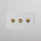 3G Two Way Toggle Switch - Antique Brass, paintable, on a white textured wall; part of 3G Switches & Dimmers.