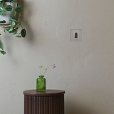 1G Double Pole Rocker Switch in Polished Nickel White on a beige wall, part of the 1G Switches & Dimmers collection.