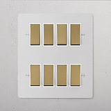 8G Two Way Rocker Switches on a white panel, paintable in antique brass, for 8G Switches & Dimmers use.