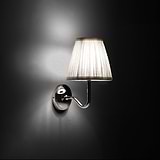 Small Malvern Wall Light in Alabaster White at an angle and turned on at night