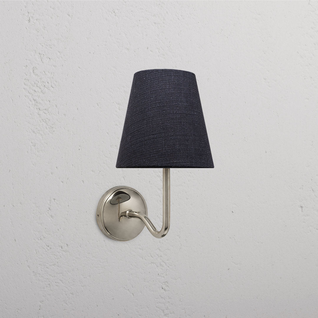 Malvern Medium Wall Light Basalt Grey - Polished Nickel with a sleek design and dark fabric shade on a white wall.