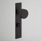 Bronze Onslow Long Plate Sprung Door Knob & Thumbturn on white wall, for Door Handles Long Plate.