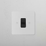 Paintable black 45A cooker isolator switch on a textured surface.