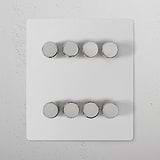 8G Dimmer Switch in paintable polished nickel with 8 round knobs on a square plate, enhances wall aesthetics.