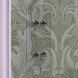 4G Vertical Two Way Toggle Switch in clear polished nickel finish against ornate green wallpaper backdrop.