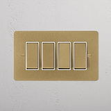 Antique brass 4G two-way rocker switch with white panel on wall, part of 4G switches & dimmers collection.