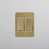 Antique Brass White 2G Two Way Rocker Slimline Switch shown on textured wall.