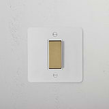1G Centre Retractive Rocker Switch in paintable antique brass on a white surface. Suitable for 1G switches & dimmers.