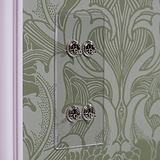 4G Vertical Two Way Toggle Switch in clear polished nickel finish against ornate green wallpaper backdrop.