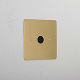 Flex Outlet - Antique Brass Black 1G socket on a white textured wall.