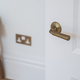 Digby Sprung Door Handle - Antique Brass