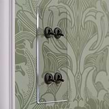 Clear bronze 4G vertical two-way toggle switch on green floral wallpaper, part of 4G Switches & Dimmers collection.