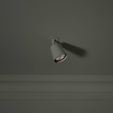 Pembroke Spotlight 70mm - Paintable, on a dark green wall, offering customizable elegance to enhance room decor.