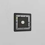 Bronze 1G switch plate made of brass, fits standard switch for a stylish touch against a white wall.