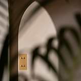 Antique brass 4G vertical two-way toggle switch on a wall, part of 4G switches & dimmers collection.